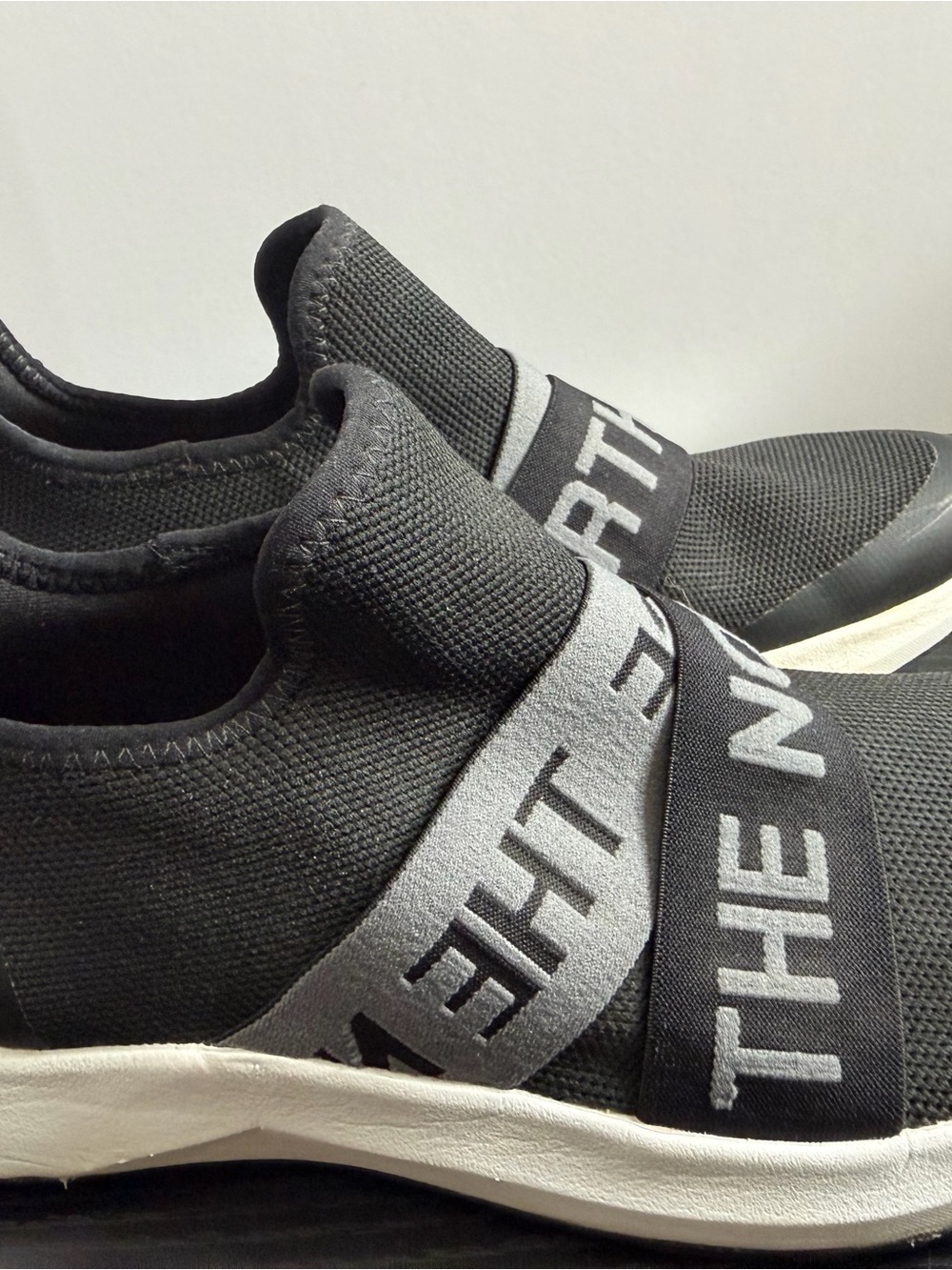The North Face Women's Black Knit Slip-On Sneakers with Gray Branded Straps